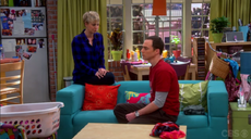 Penny helping Sheldon.