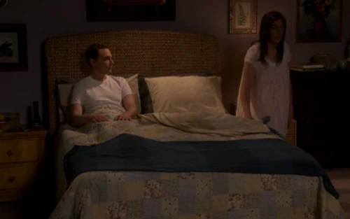 Amy crawling into bed.