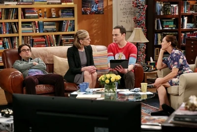 Sheldon showing his pictures.