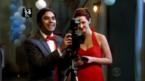 Raj taking photos of the prom couples.