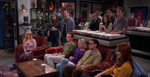 Raj and Howard playing their song to a comic book store audience.