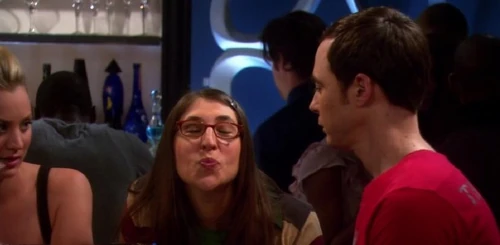 Amy puckers up so that Sheldon can experiment kissing with her.