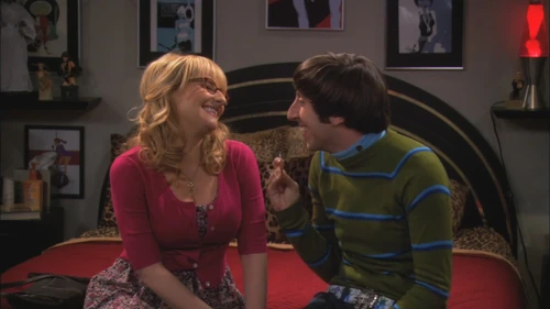 Howard pulls a condom out of Bernadette's ear.