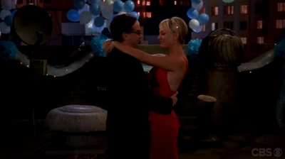 Leonard and Penny dancing at the prom.