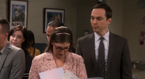 Amy looking over their marriage license.