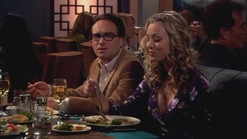 Leonard and Penny having dinner together.