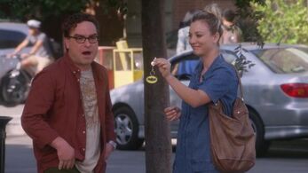 Penny dangles keychain in front of Leonard