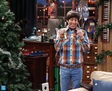 Jewish boy enjoying trimming the Christmas tree.