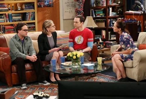 Both mothers are discussing Sheldon's brilliance and Leonard is jealous.