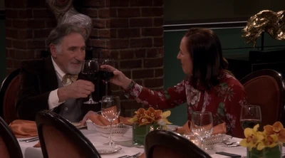 Toasting each other.