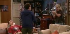 Slapping Sheldon.