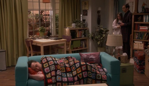 Amy finds Leonard on their couch.