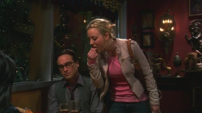 Penny trying Leonard's dinner during his date with Priya.