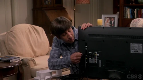 Howard setting up the television.