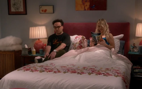 Brings comic to bed.