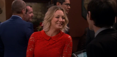 Penny flirting to get a table.