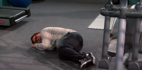 Leonard with cramps on the floor.