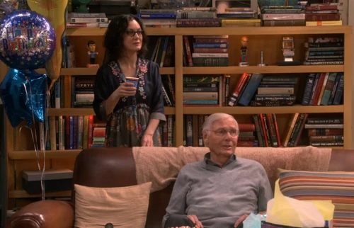 Adam West and Leslie in the background.