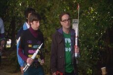 Howard and Leonard launching model rockets in the park.