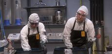 Leonard and Sheldon both scrubbing out irradiated grease