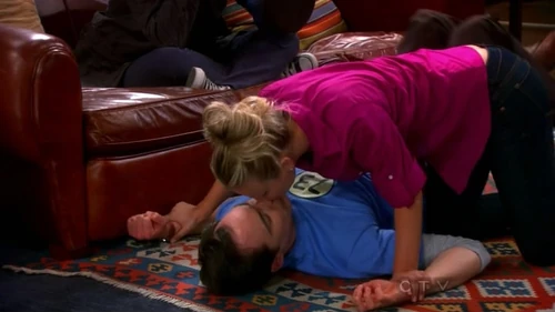 Penny kissing Sheldon.