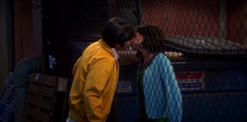 Kissing Lucy through the fence she is trapped behind.