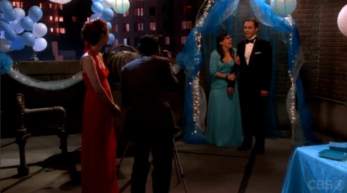 Taking Amy and Sheldon's picture.