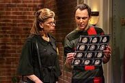 Sheldon looking at brain scans with Beverly.