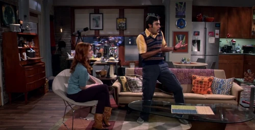 Raj showing Emily how you can dance to their song.