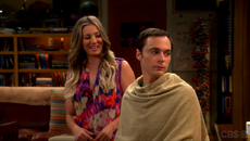 Sheldon getting a haircut from Penny.