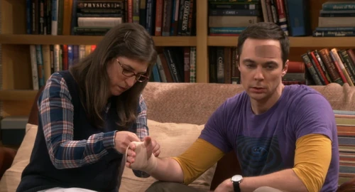 Amy helping Sheldon.