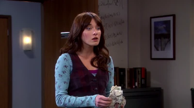 Sheldon hands her a lot of cash to get Amy a Valentine's Day gift.