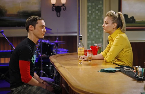 Sheldon seeking advice from his local barkeep, Penny.