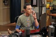 Sheldon on the phone at his desk.