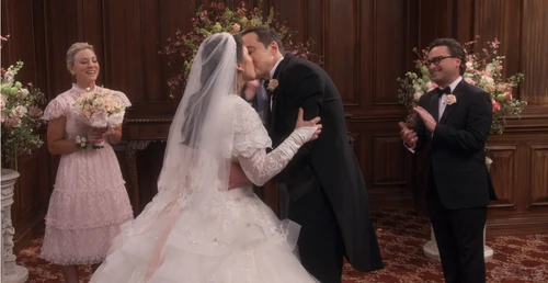 Applauding the married couple.