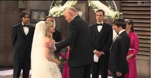 Mr Rostenkowski prepares to give Bernadette over to Howard at the altar.