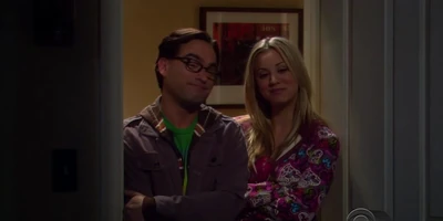 His "parents" proudly watching Sheldon sleep. Sheldon keeps them together as friends after they broke-up