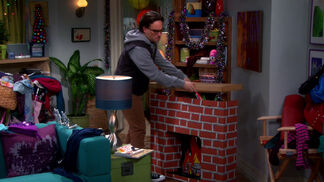 Leonard building a fireplace