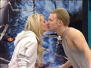 Nicole kisses Rex over the Big Brother 9 divide