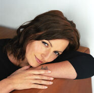 Davina's Big Brother 6 publicity photo with a bit of long hair on a sofa