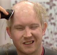 Michael shaves his head for a task in Big Brother 9