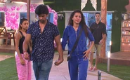 Gauahar walks out of the house.