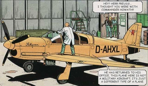 The Renkell Swan as imagined by Francis Bergèse in . There is not much description in the text except that it is of a ochre colour which this is. Biggles observed a family resemblance in the shape of the rudder. The artist has faithfully reproduced this as can be seen by comparing it with the drawings of the . However the original novel states that Renkell preferred ovals. The  rudder here is not oval.