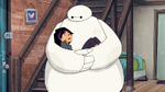 Go Go sleeps in Baymax's arms