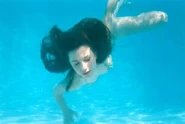 Erin Sanders swimming underwater
