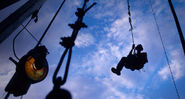 September 7, 2009: A worker returns to earth after lubricating the top of a drilling rig