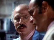 Rudy advises Oscar of a problem with Erica's experiment.