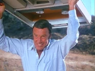 the robot hurls a mainframe at Austin