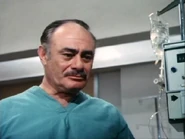 Martin Balsam as the first Rudy Wells