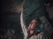 Steve holds up the collapsing cave roof